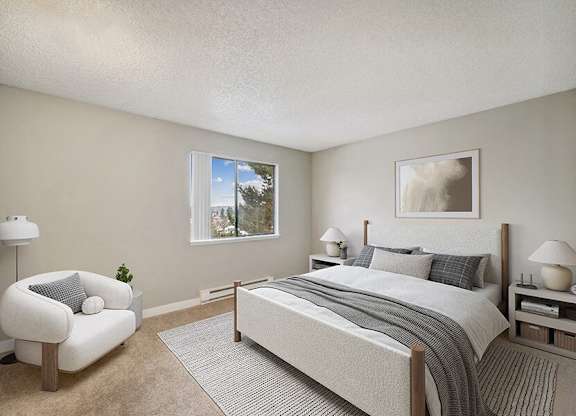 Model Bedroom with Carpet and Window View at Grammercy Apartments located in Renton, WA.