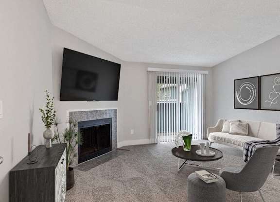Federal Way, WA, Pet-Friendly Apartments - Sunset Three Twenty - A Living Room With A Wall-Mounted TV Above A Fireplace, A Sofa, Chairs, A Round Coffee Table, And Wall Art.