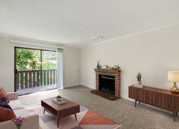A living room with a fireplace and a couch.