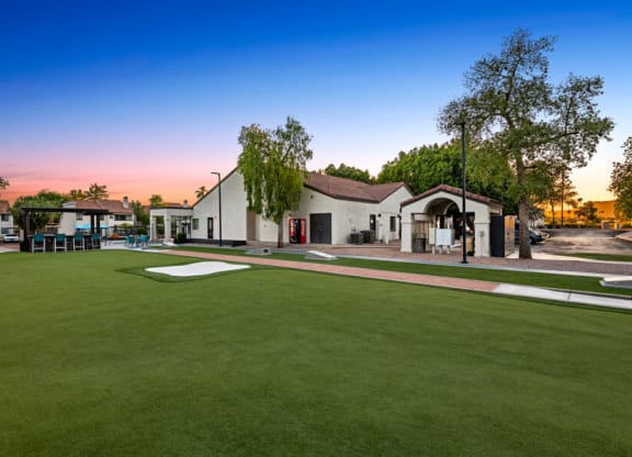 a yard with a golf course and a house in the background at Lore South Mountain, Phoenix, AZ