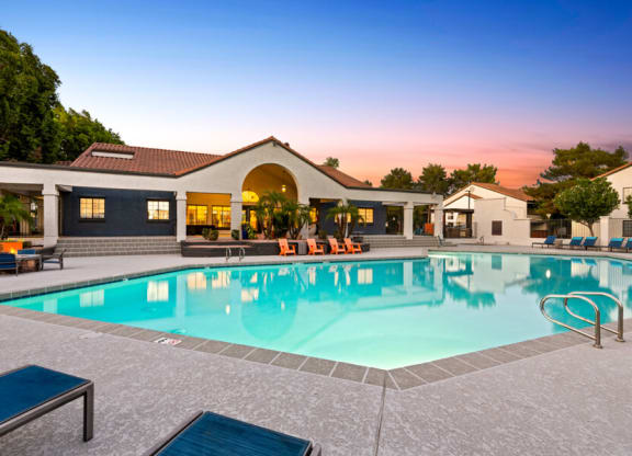 a swimming pool in front of a house with a resort style pool at Lore South Mountain, Phoenix, AZ