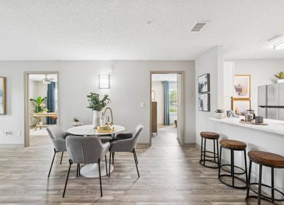Model kitchen and dining at Mirage on Kernan Apartments in Jacksonville, FL