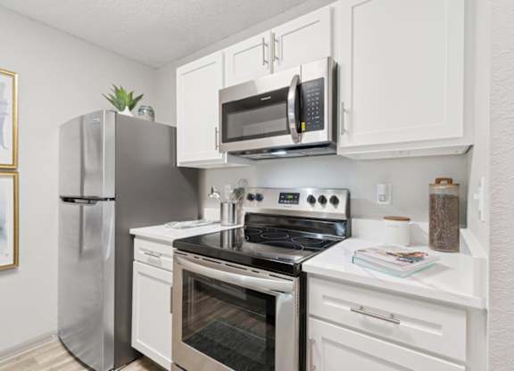 Model kitchen with stainless steel appliances at Mirage on Kernan Apartments in Jacksonville, FL