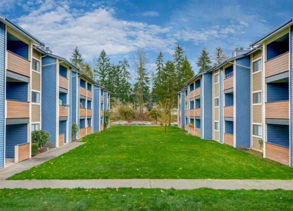 Apartment building exteriors and well kept landscape