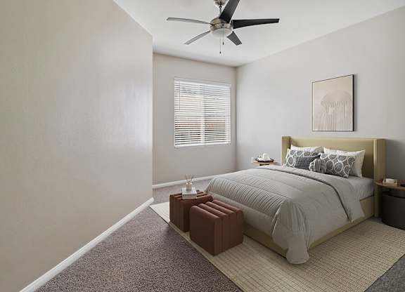 A bedroom with a bed, nightstand, and window with blinds.