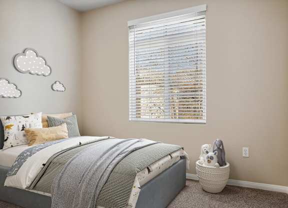 A bedroom with a bed, pillows, a window with blinds, and cloud wall decals.