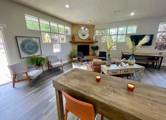 A dining room with a wooden table and chairs.
