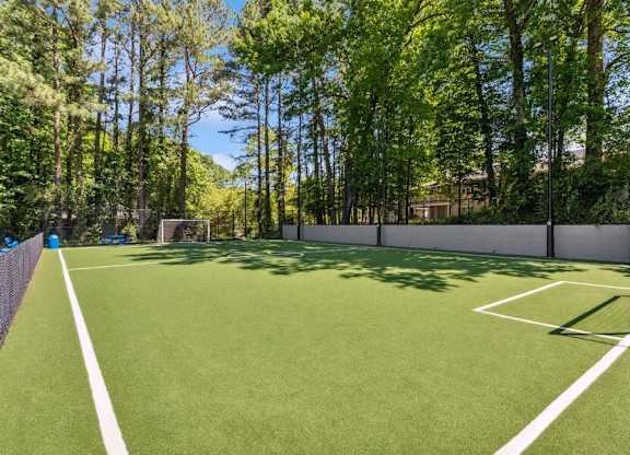 A soccer field with a goal post on the right side.