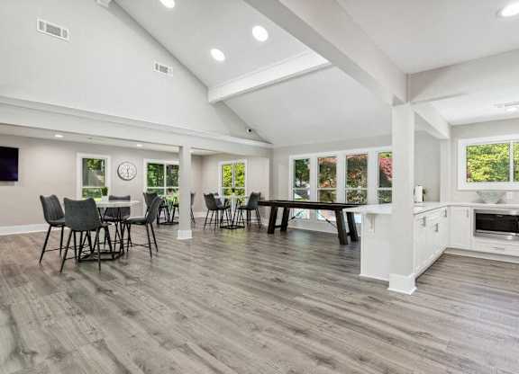 A spacious kitchen and dining area with a modern design.