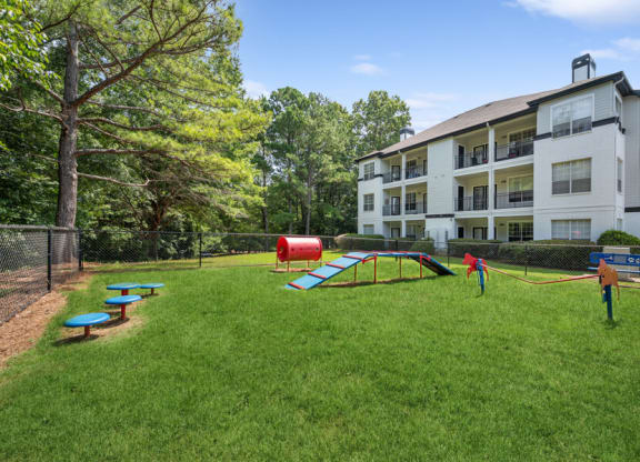 our apartments offer a dog park with a playground