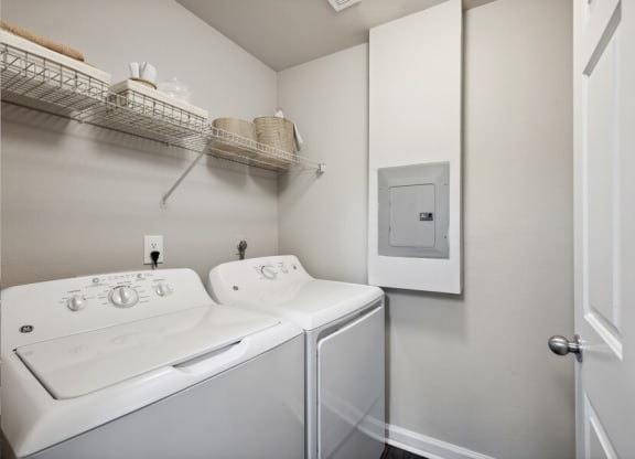 a white washer and dryer in a room