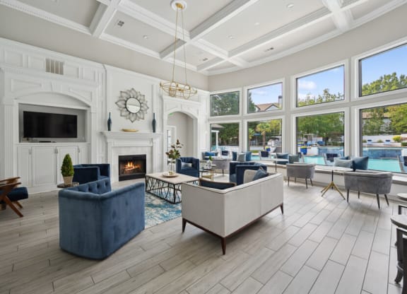 the estates at tanglewood|living room with fireplace and large windows