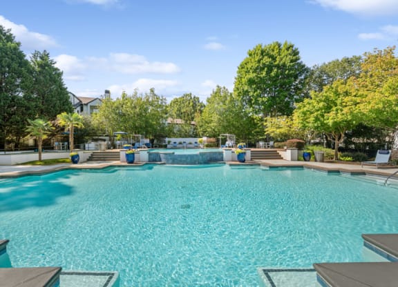 the preserve at ballantyne commons community pool and hot tub with trees in the background