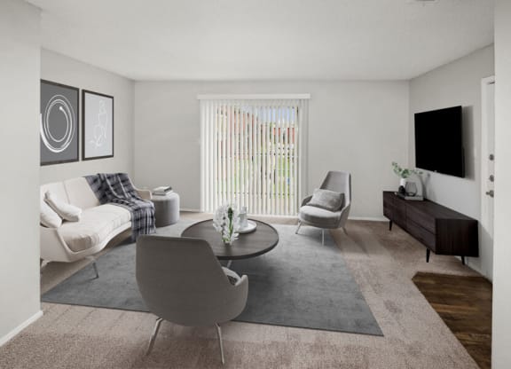 Model apartment living room with a couch and a table