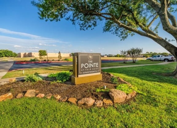 Apartment entrance sign and landscaping