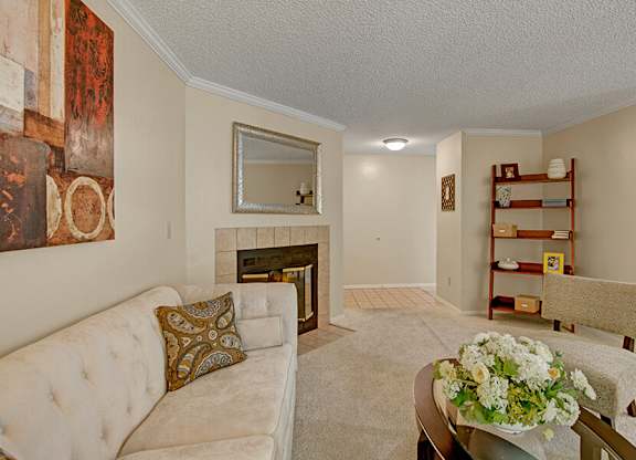 Model Living Room and Fireplace at Ridge & Shores Apartments located in Federal Way, WA.