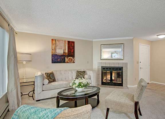Model Living Room and Fireplace at Ridge & Shores Apartments located in Federal Way, WA.