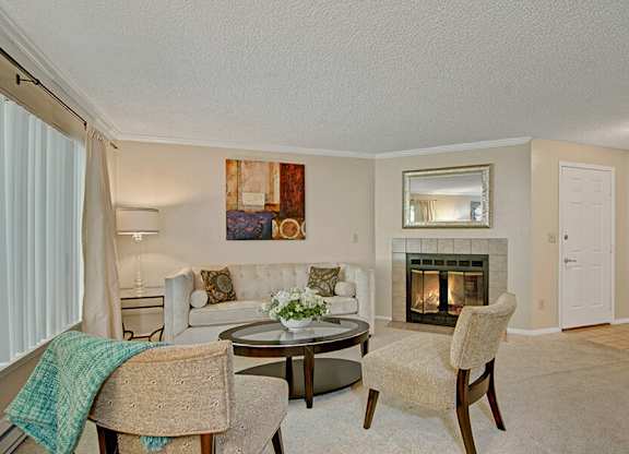 Model Living Room and Fireplace at Ridge & Shores Apartments located in Federal Way, WA.