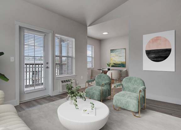 A living room with a white couch, a green chair, and a painting on the wall.