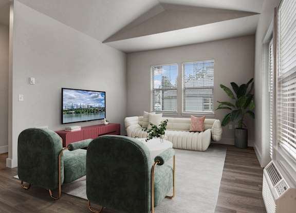 A living room with a television, two chairs, and a couch.