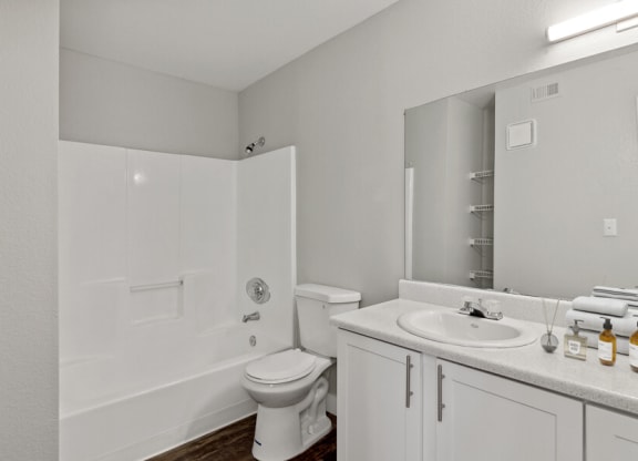 a bathroom with a toilet sink and bathtub