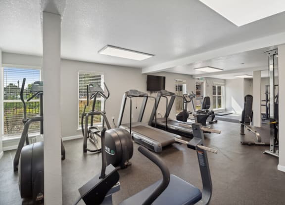 fitness center with exercise equipment
