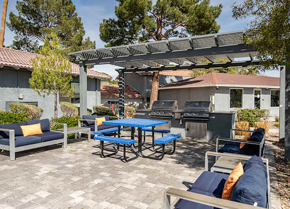 Outdoor Grilling Stations at Bridges at Tropicana Apartments located in Las Vegas, Nevada.