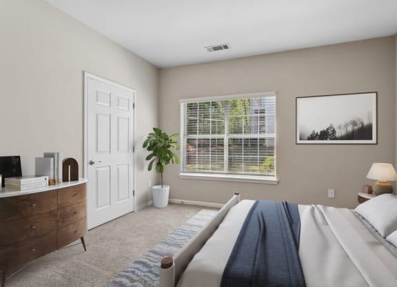Bedroom with a large bed and a window