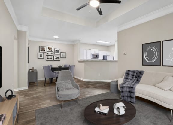 Model apartment living room with a couch and a table