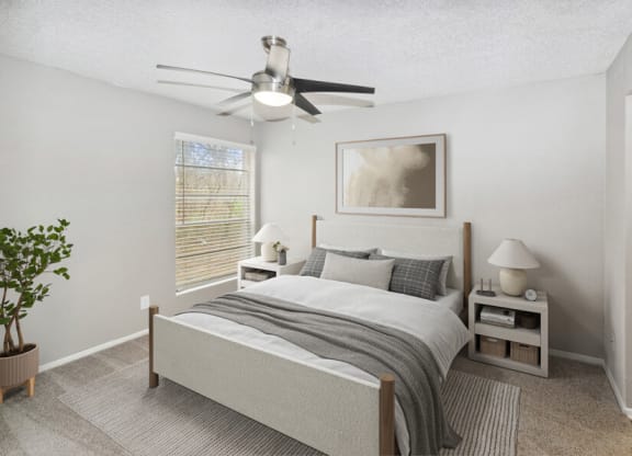 a bedroom with a bed and a ceiling fan
