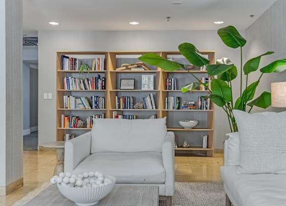 Community library lounge with reading area at Pier Village Apartments, Long Branch, NJ 7740
