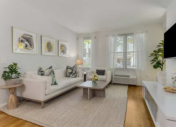 Bright living room with modern furnishings at Pier Village Apartments, Long Branch