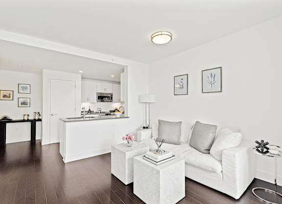 Living room with white couch at 65 Bay Street, Jersey City, NJ, 07302