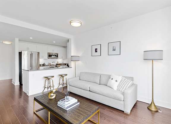 Living room with white couch and table at 65 Bay Street, Jersey City, 07302
