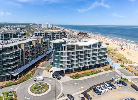 Modern beachfront buildings with curved architecture and oceanview at Pier Village Apartments, Long Branch, New Jersey