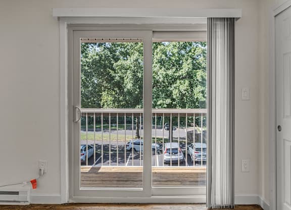 Room with Glass Doors at Atlantic Pointe Apartments, Atlantic Highlands