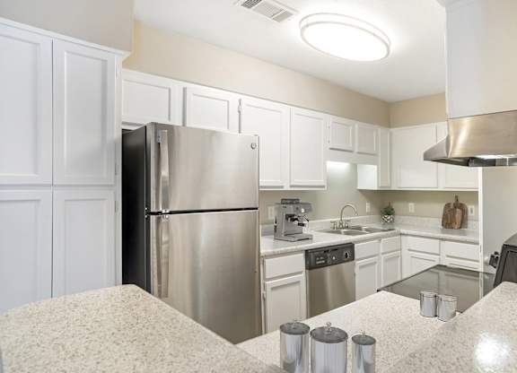 Kitchen with refrigerator at Arbors at Natchez Trace Apartments, Ridgeland, MS