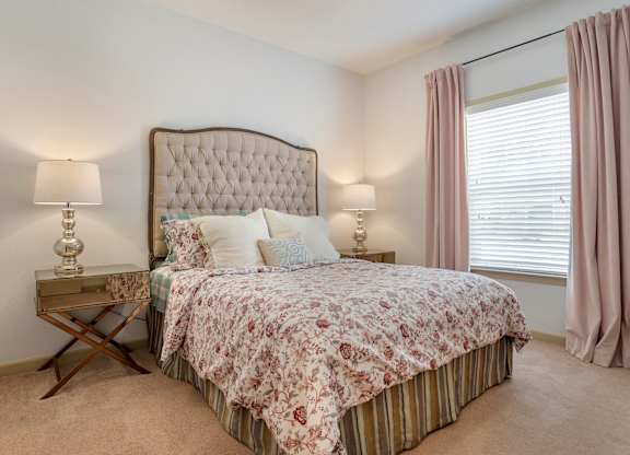 Bedroom with large window at Broadstreet at EastChase Apartments, Alabama
