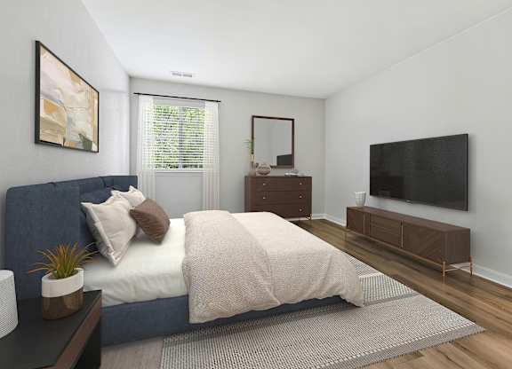 A bedroom with a bed, nightstand, and a television.