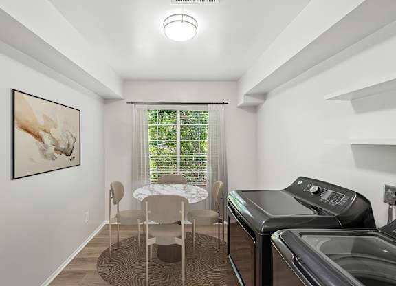 A laundry room with a washer and dryer.