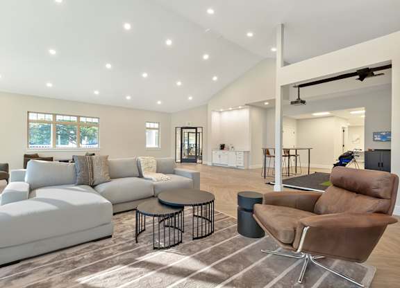 a living room with couches and a table at Copper and Quarry Village, Pikesville, MD