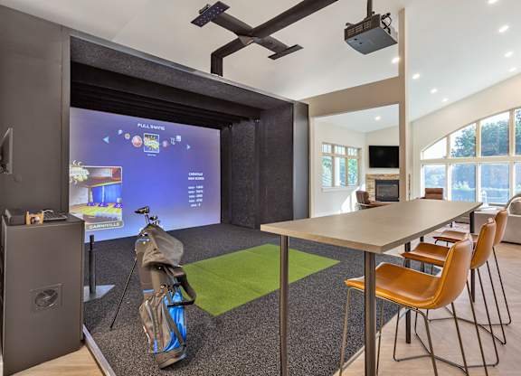 a conference room with a table and chairs and a projector screen at Copper and Quarry Village, Pikesville, 21209
