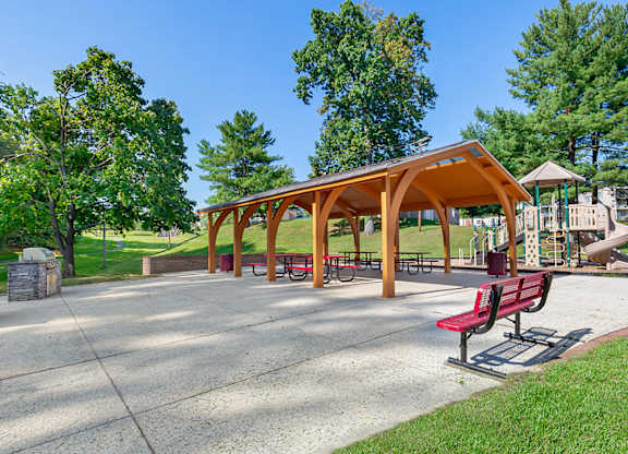 a park with benches and a picnic shelter at Copper and Quarry Village, Maryland