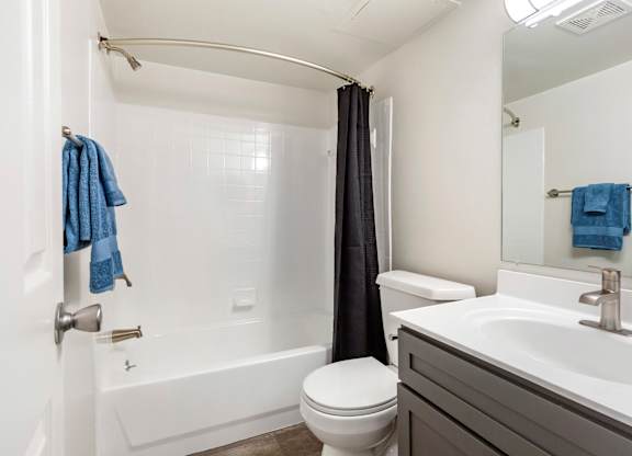 a bathroom with a sink toilet and bathtub at Copper and Quarry Village, Pikesville, MD, 21209