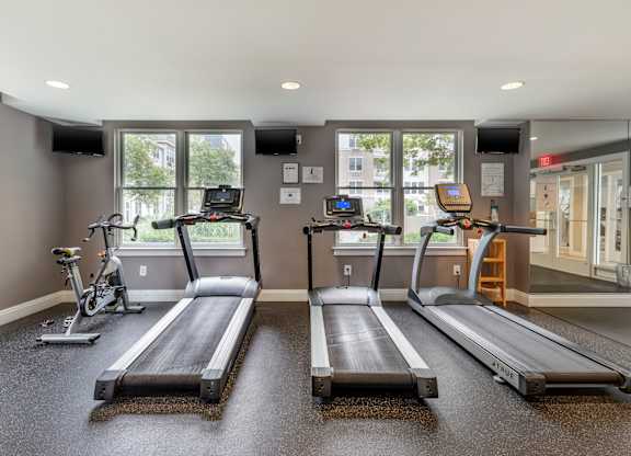 Fitness room with treadmills and spin bike at Pier Village Apartments, Long Branch, New Jersey
