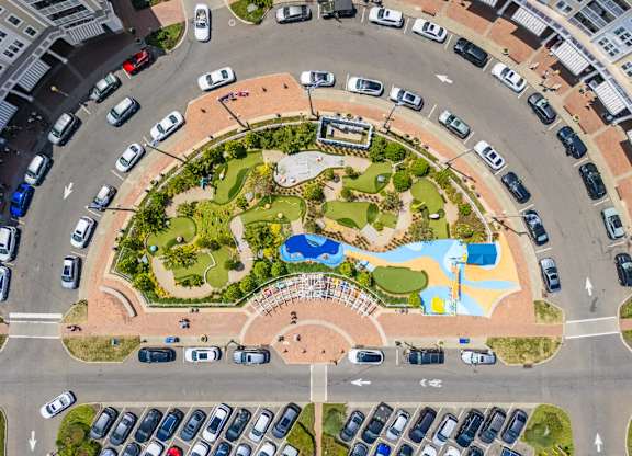 Aerial view of circular mini golf course with parking at Pier Village Apartments, Long Branch