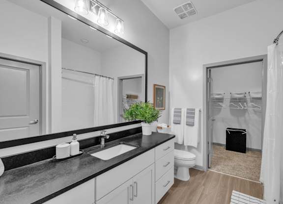 A Bathroom with a Black Countertop at District 757 Apartments, Norfolk, 23502