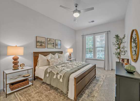 A Bedroom with a Ceiling Fan at District 757 Apartments, Norfolk, VA