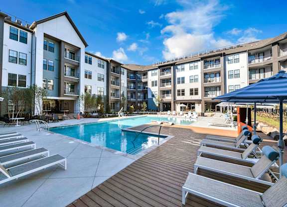 A Pool Area with Sun Loungers at District 757 Apartments, Virginia, 23502