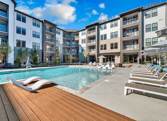 A Pool with Lounge Chairs at District 757 Apartments, Virginia